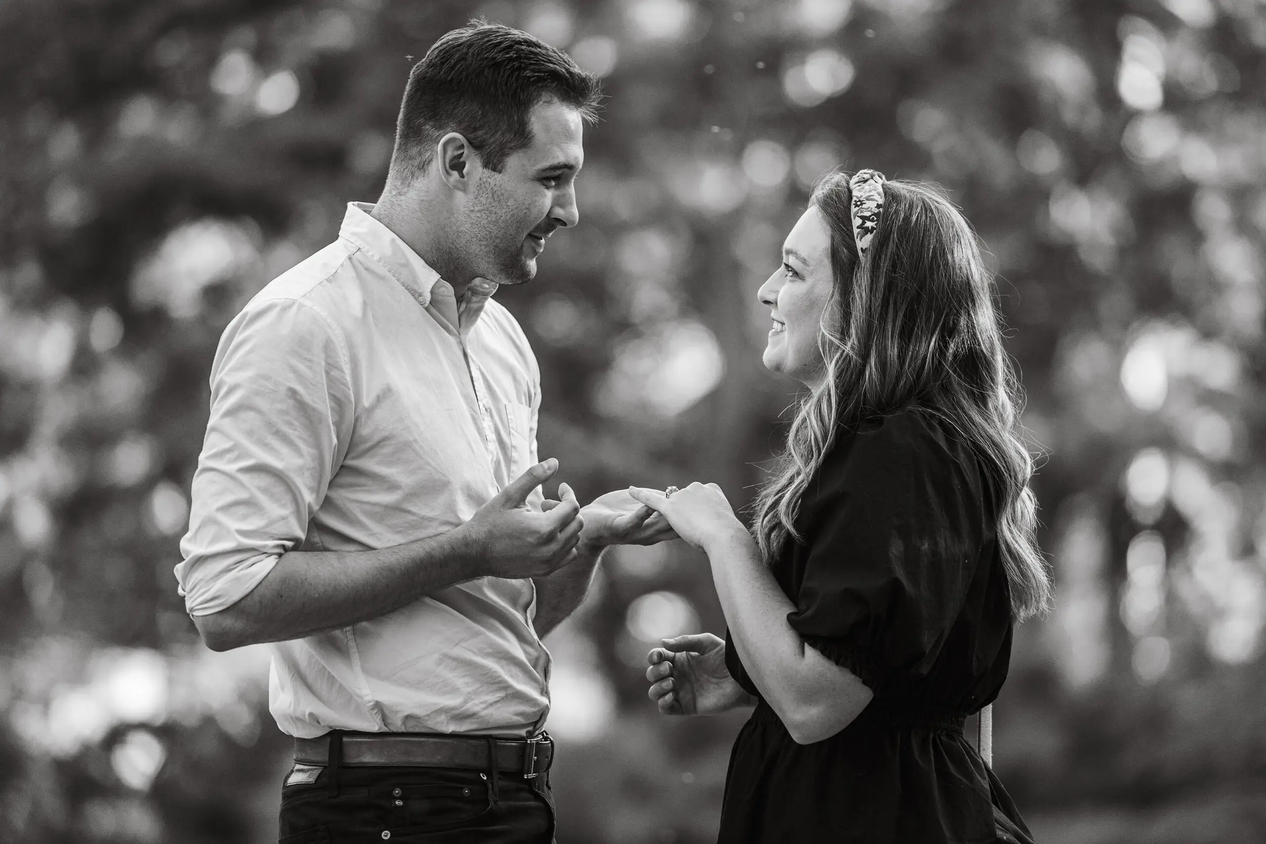 Denver Botanic Gardens proposal with Dylan and Ellen as Dylan puts the ring on her finger.