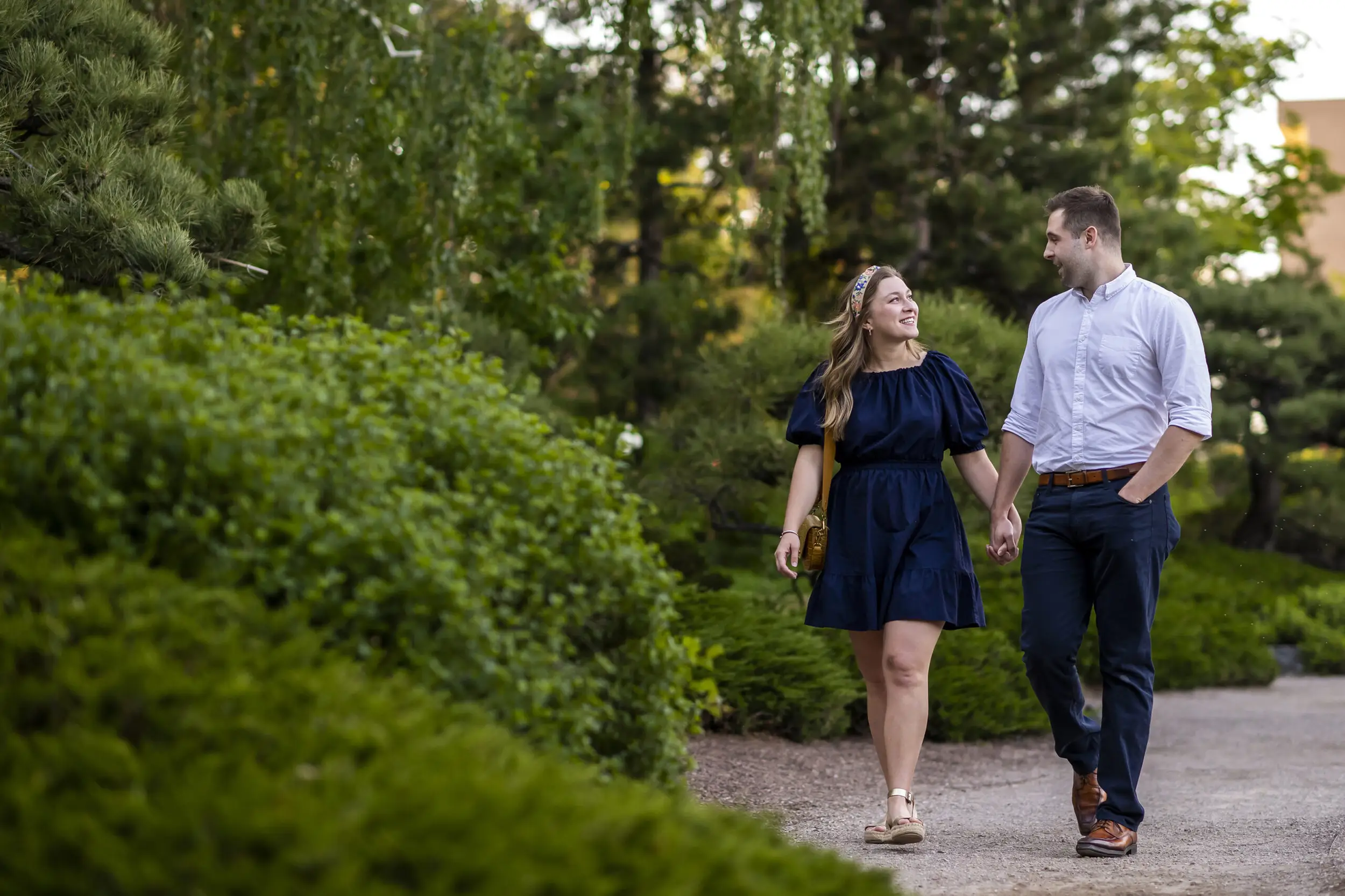 Dylan and Ellen walk after their Denver Botanic Gardens proposal session.