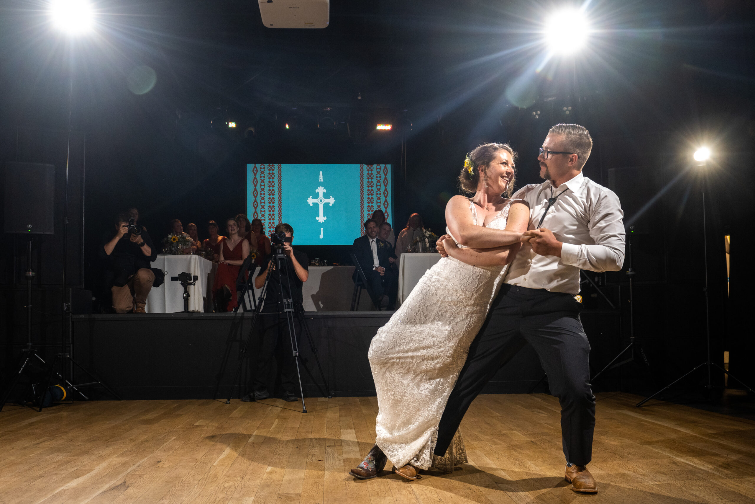 A bride and groom perform their first dance during a wedding reception at the Rose Event Center in Golden, Colorado.