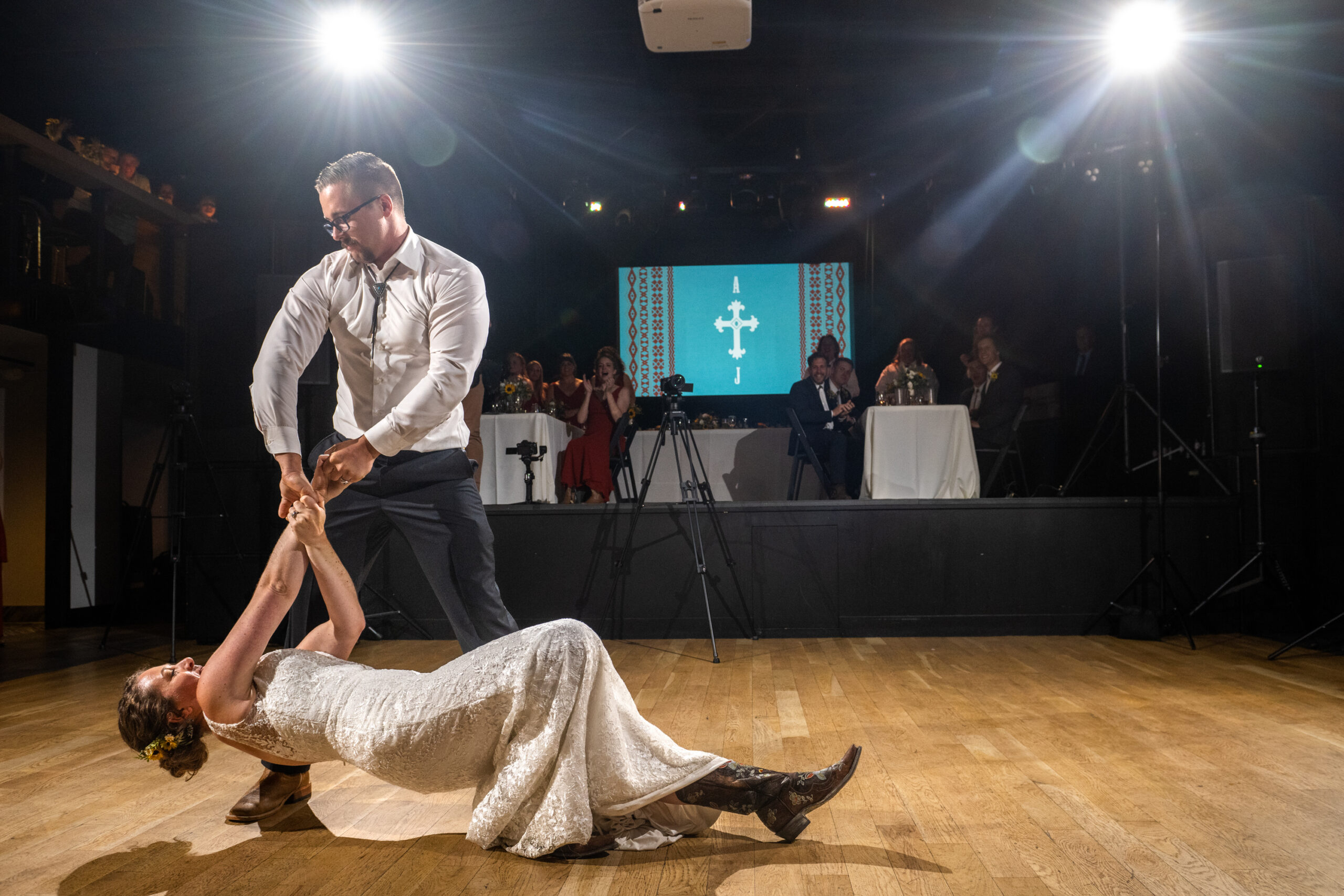 A bride and groom perform their first dance during a wedding reception at the Rose Event Center in Golden, Colorado.