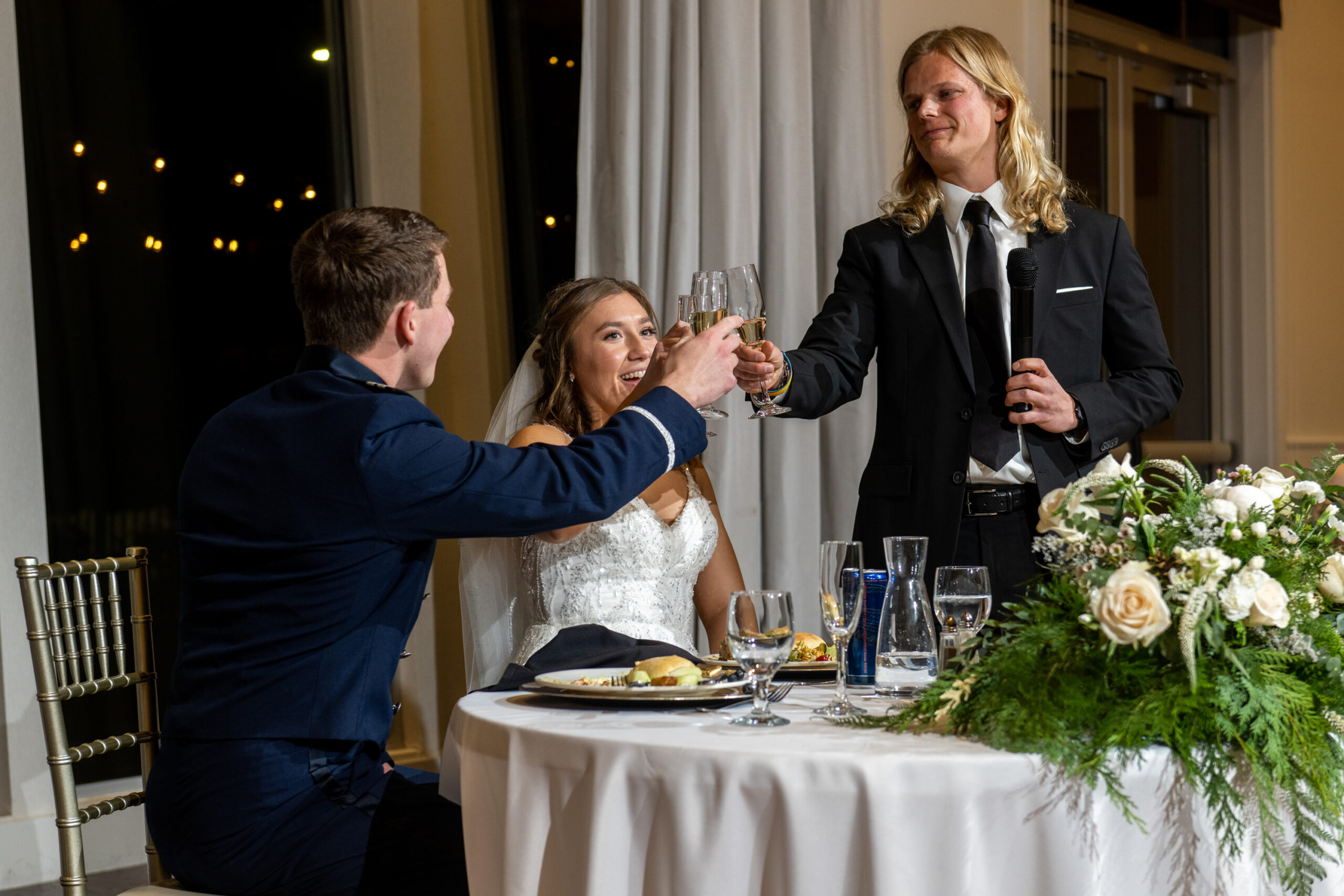 Jaime and Michael toast with the best man during their Ashley Ridge by Wedgewood wedding in Littleton, Colorado.