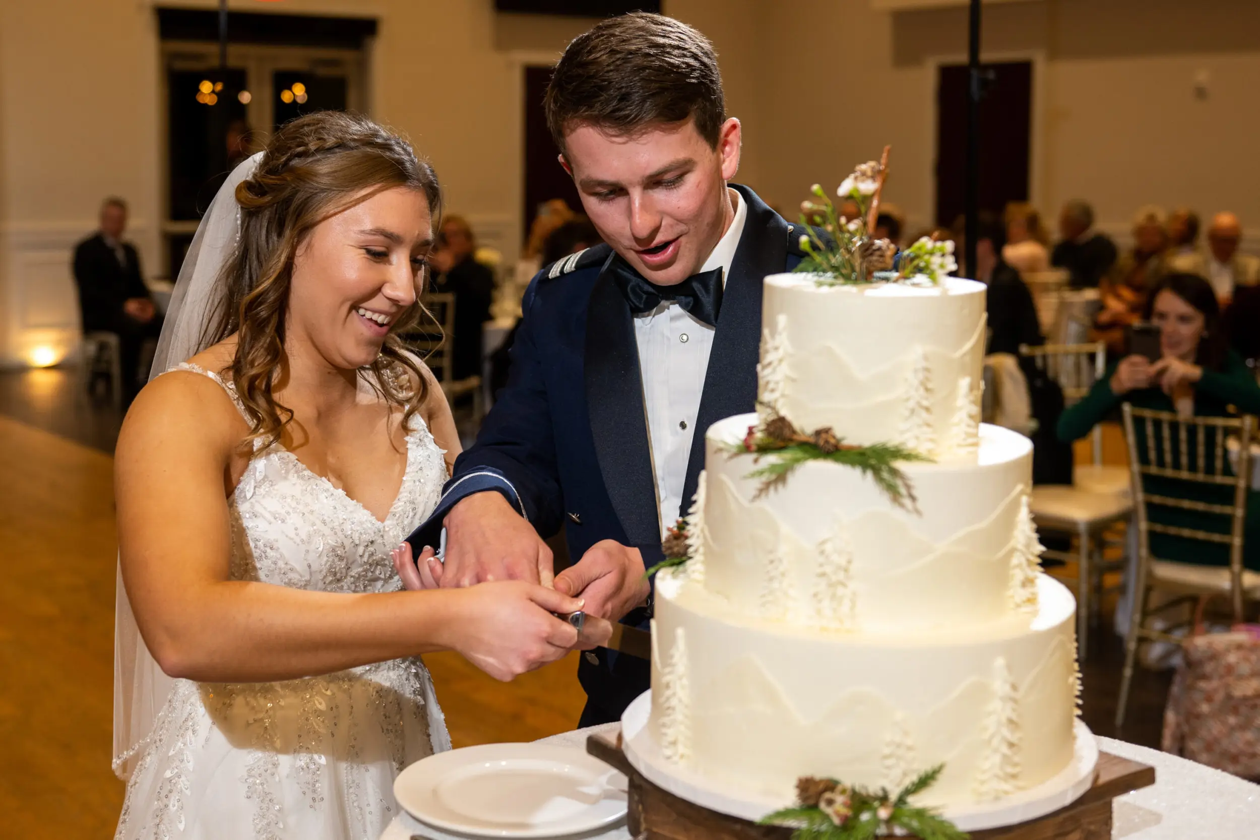 Jaime and Michael cut the cake during their Ashley Ridge by Wedgewood wedding in Littleton, Colorado.
