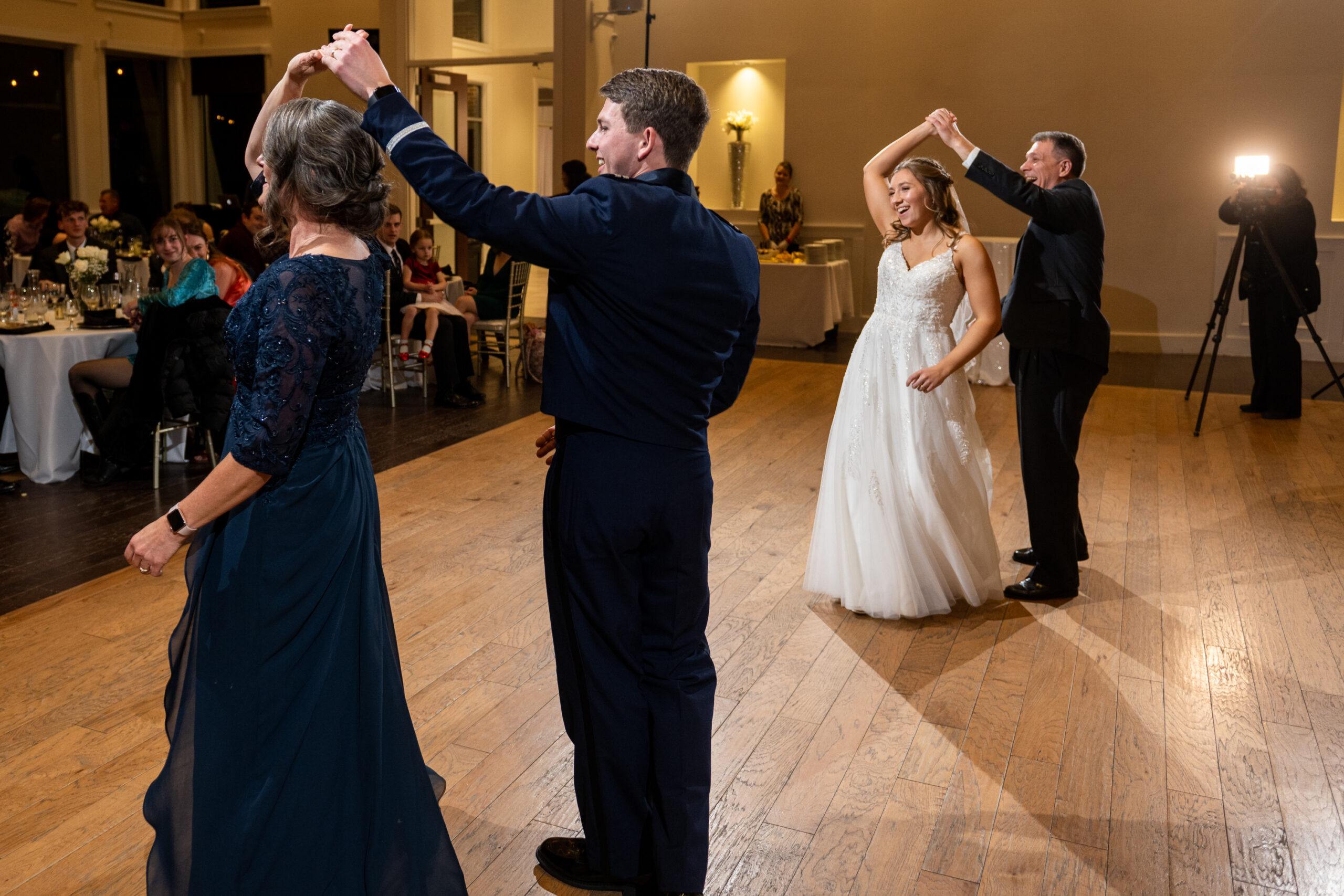 Jaime and Michael dance with their respective parents during their Ashley Ridge by Wedgewood wedding in Littleton, Colorado.