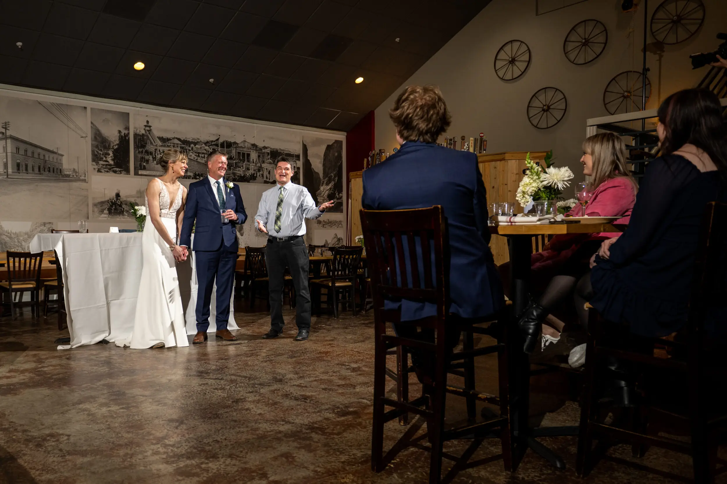 Toasts during a 2 Penguins Tap and Grill wedding reception in Centennial, Colorado.