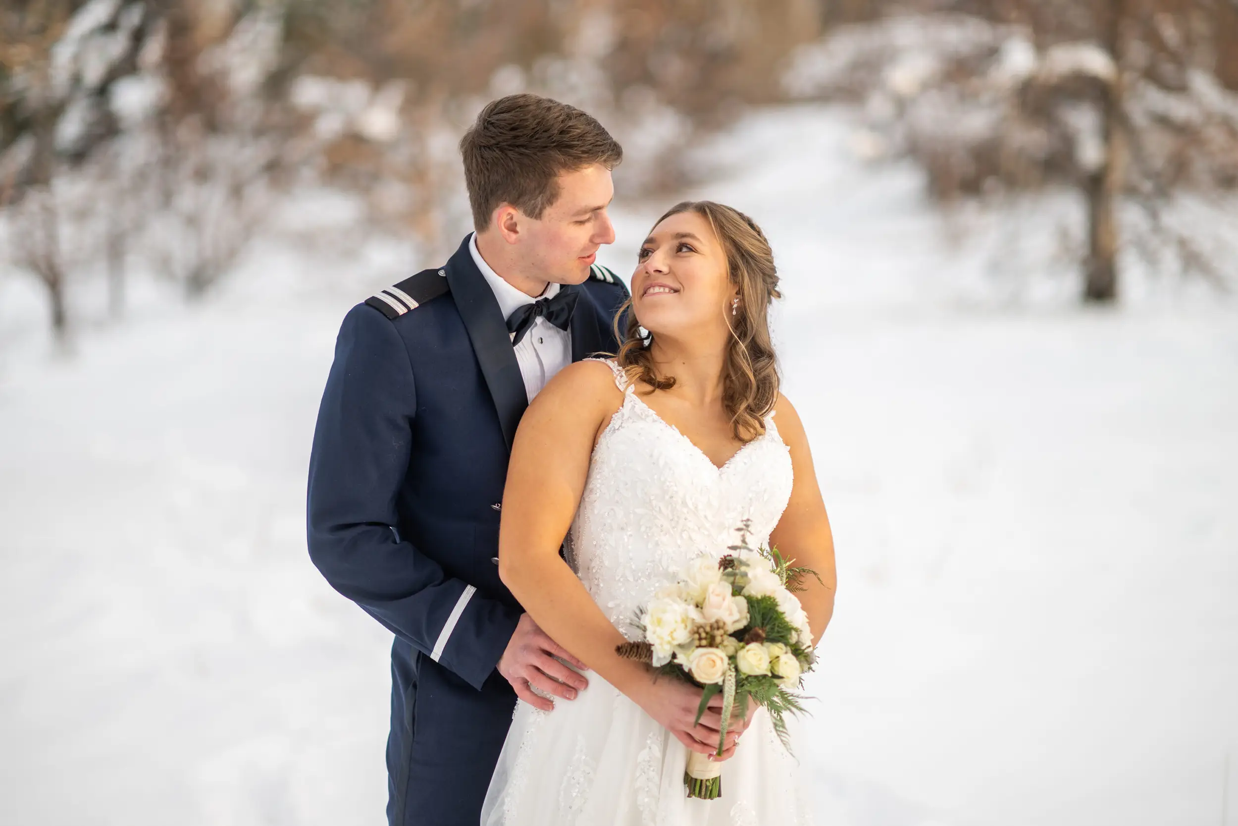 The bride and groom pose at Fly'n B Park in Littleton, Colorado, during their wedding at Ashley Ridge by Wedgewood Weddings.