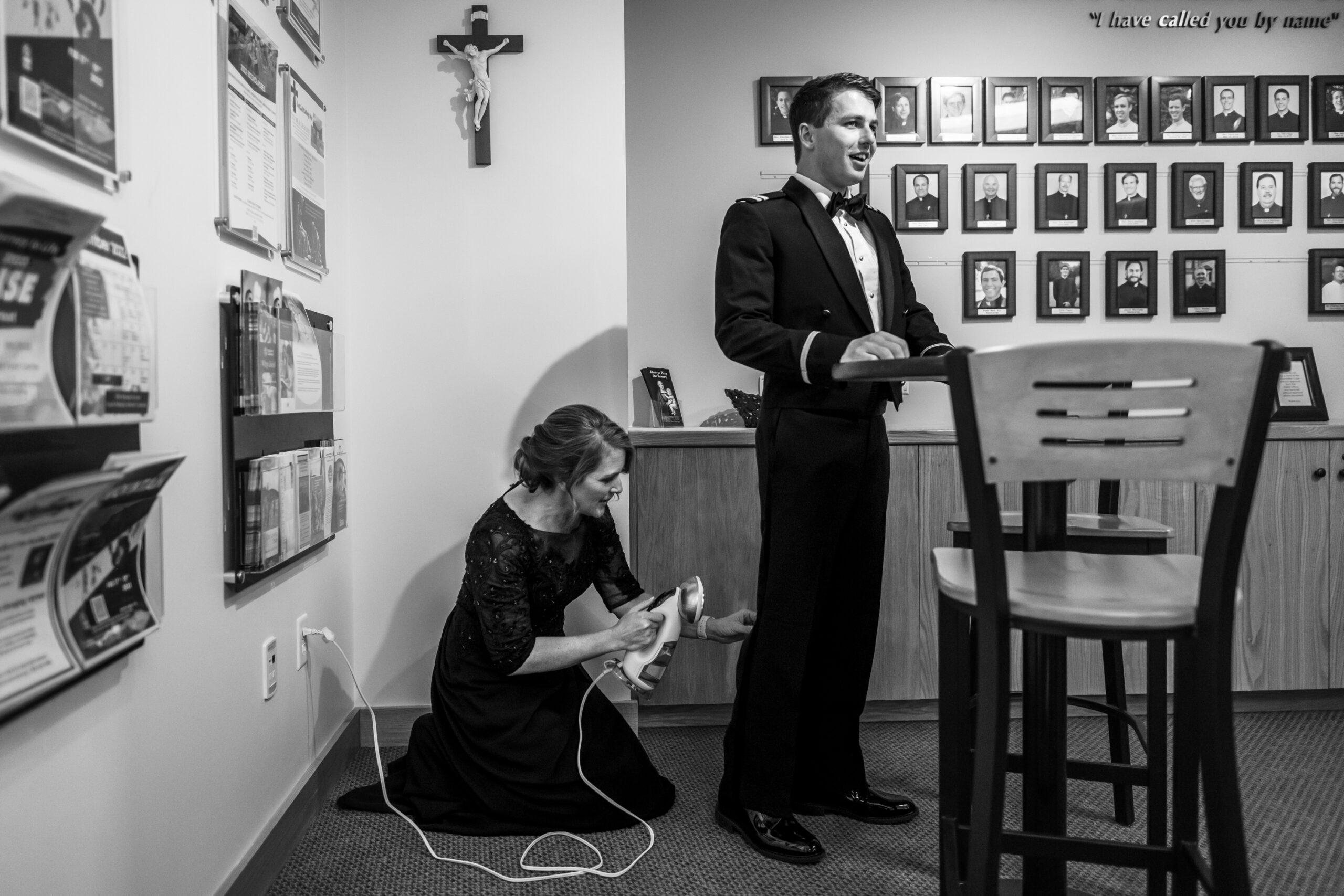 Michael's mother irons wrinkles out of his pants before a St. Thomas More Catholic Church wedding in Centennial, Colorado.