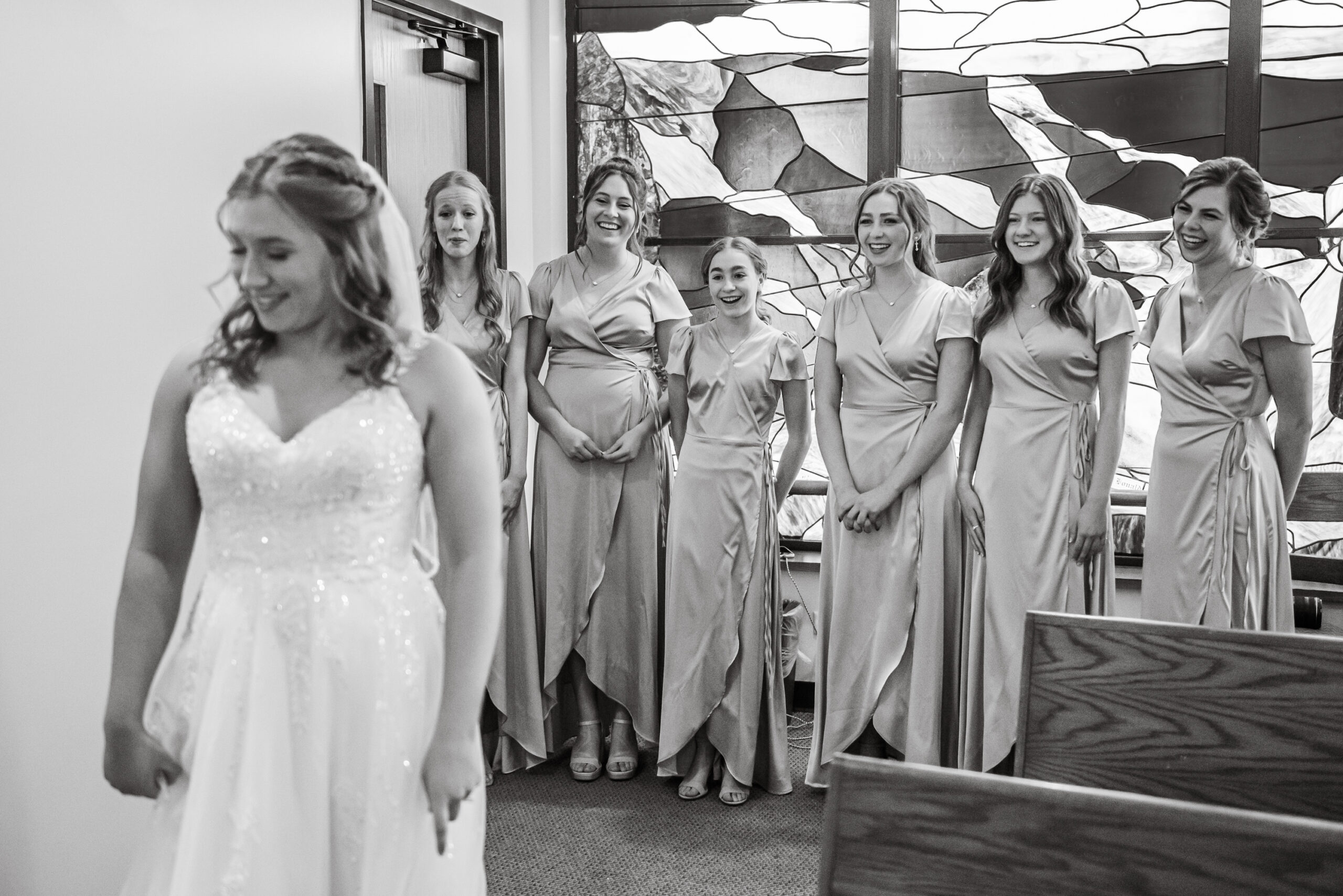Jaime reveals her dress to her bridesmaids before her St. Thomas More Catholic Church wedding in Centennial, Colorado.
