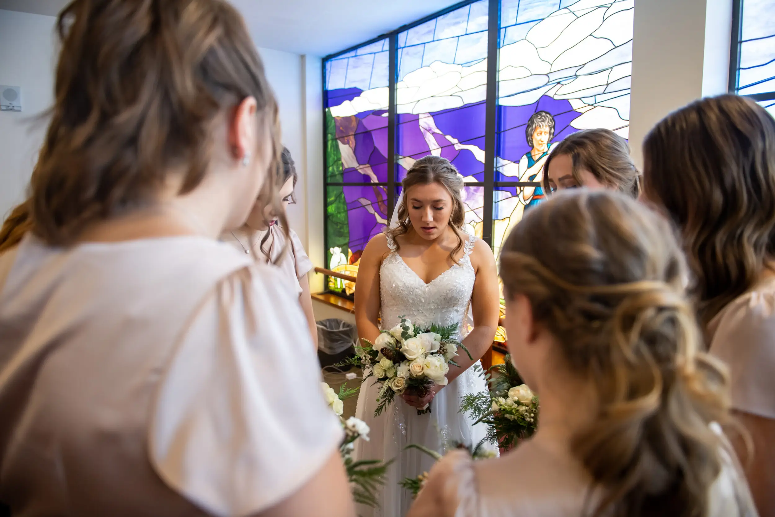 Jaime prays with her bridesmaids before her St. Thomas More Catholic Church wedding in Centennial, Colorado.