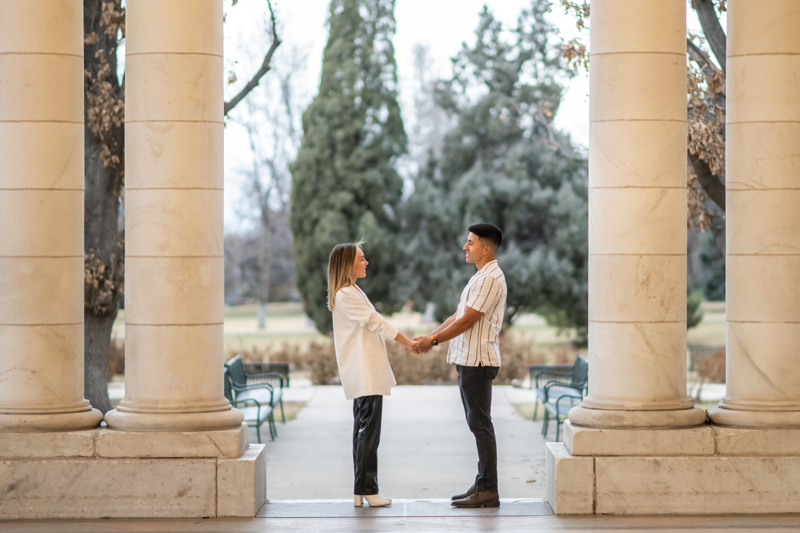 Nick and Codi hold hands after Cheesman Park secret proposal in Denver, Colorado.