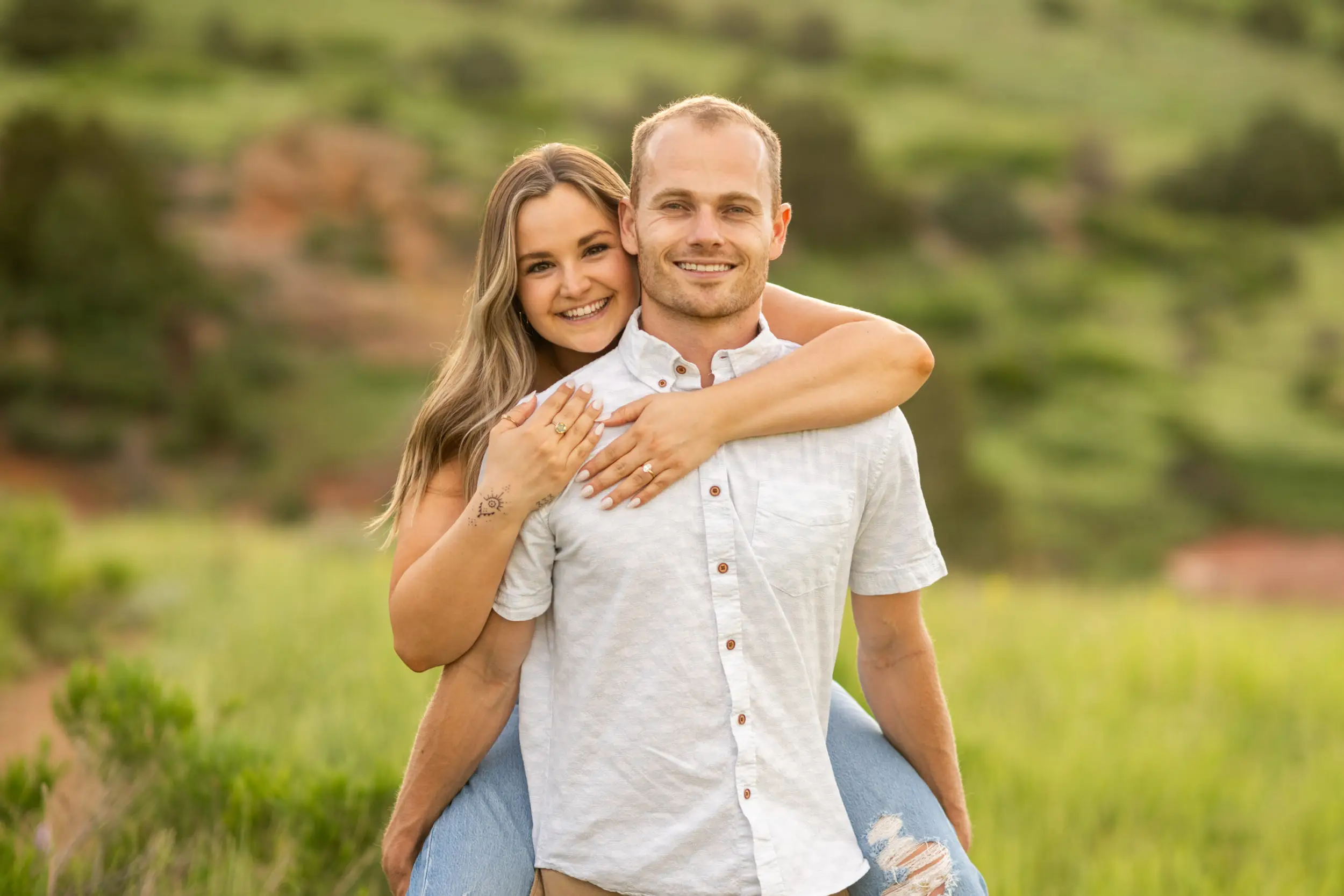 Elizabeth embraces Ryan after a surprise proposal at Mt. Falcon Park East Trailhead near Denver, Colorado.