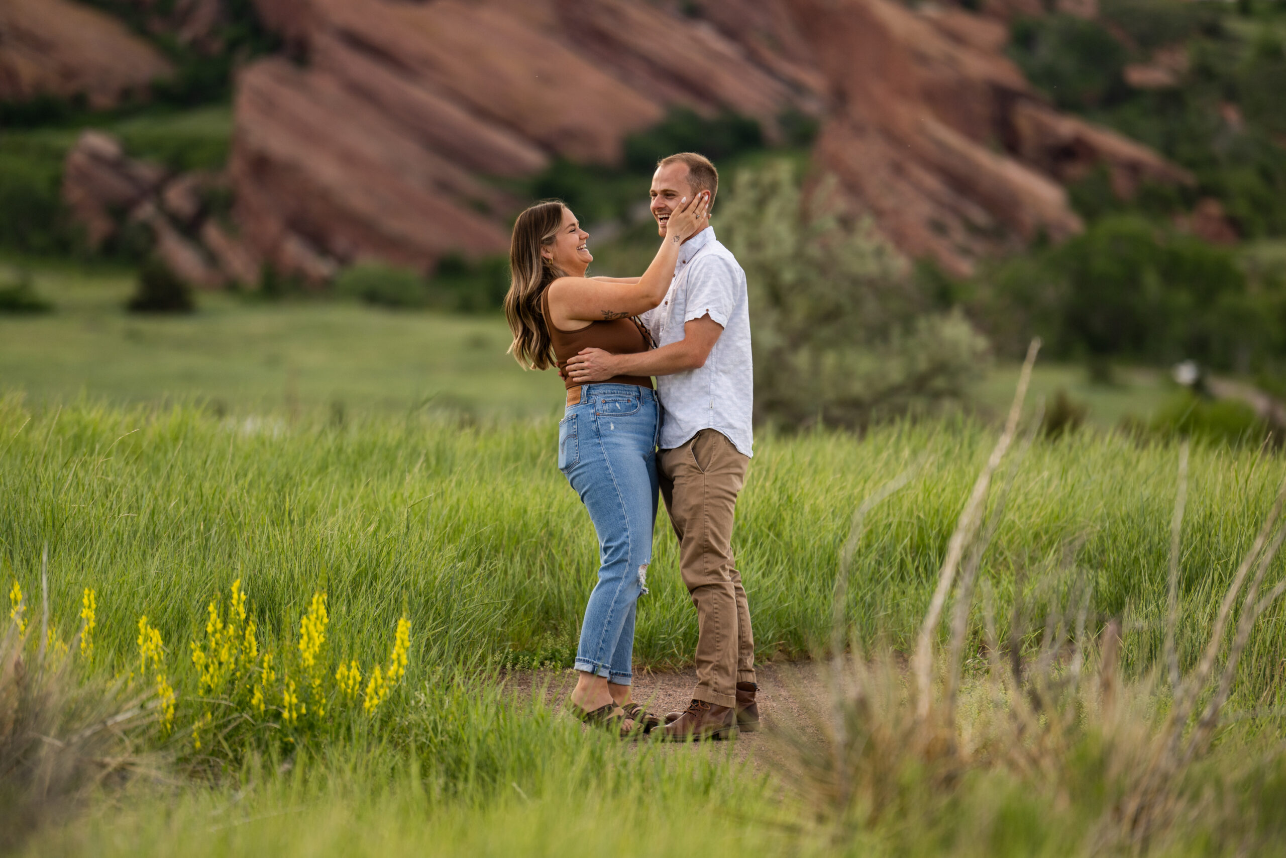 Elizabeth says yes during a surprise proposal at Mt. Falcon Park East Trailhead near Denver, Colorado.