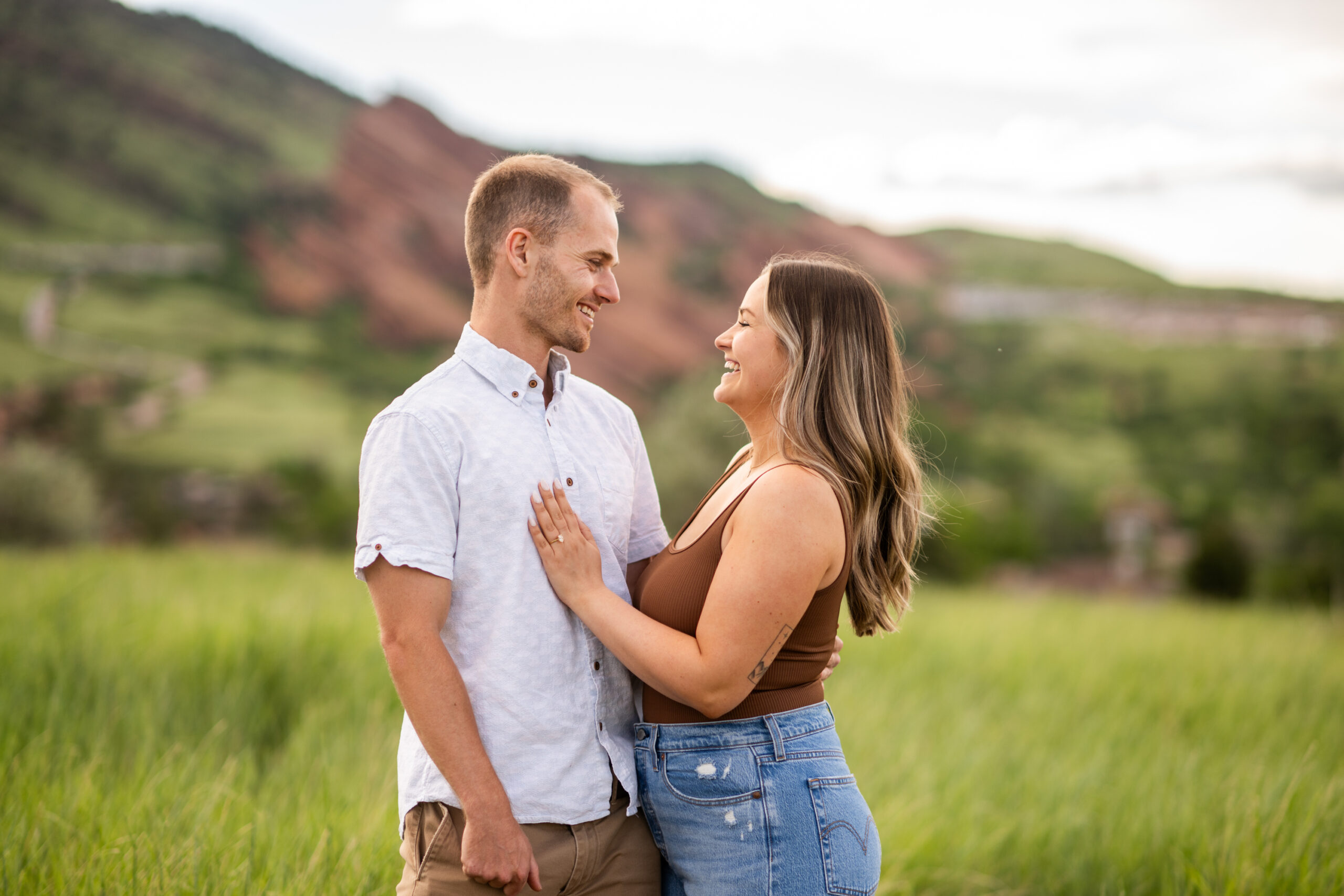 Elizabeth embraces Ryan after a surprise proposal at Mt. Falcon Park East Trailhead near Denver, Colorado.