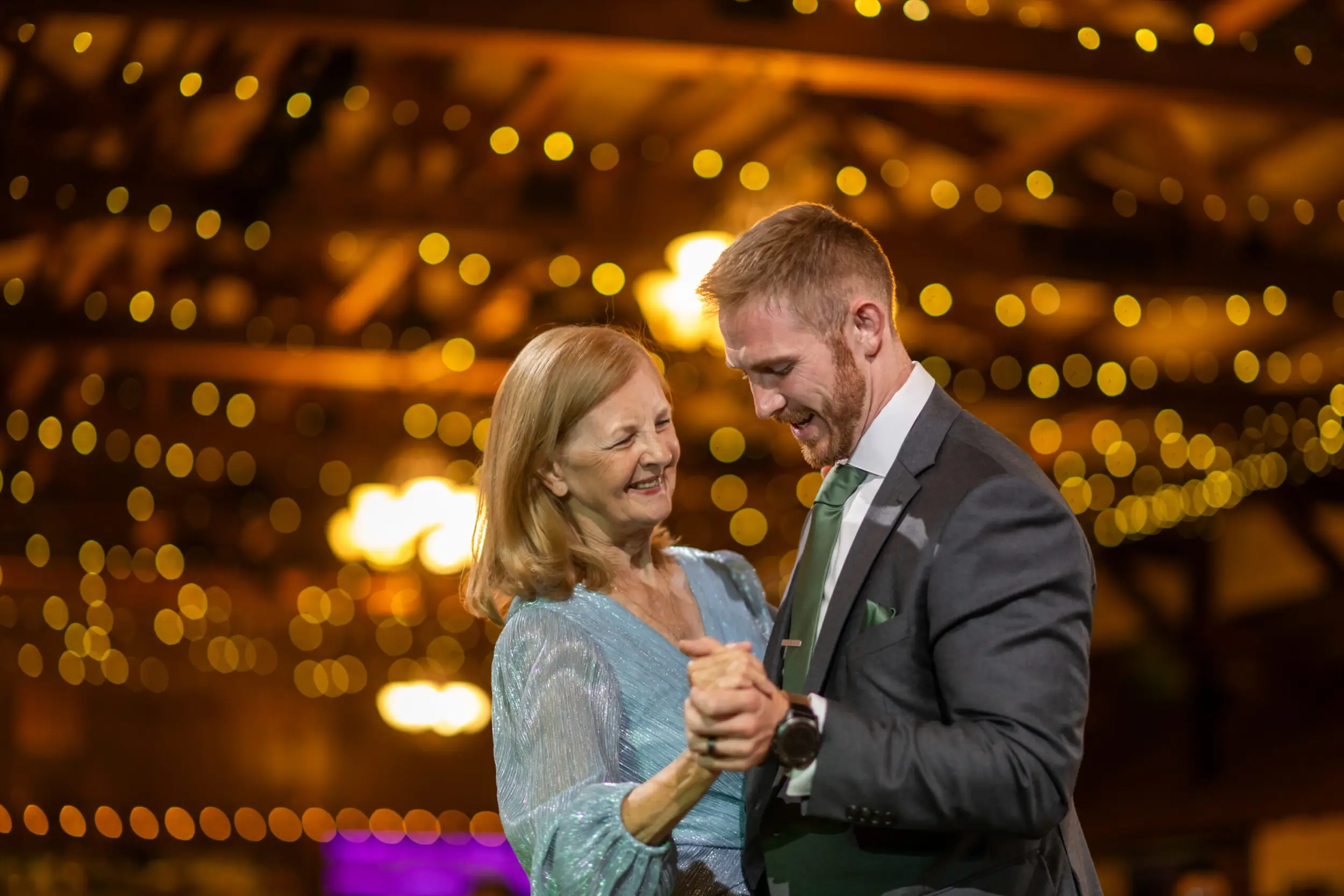 The groom dances with his aunt at his wedding reception at the Church Ranch Event Center in Westminster, Colorado.